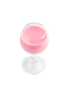 Sweet strawberry liqueur in glass isolated on white background. side view, close up