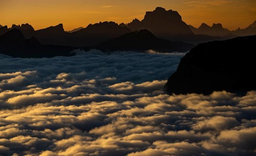 Sunrise over a sea of fog and Dolomite peaks in the background, Corvara, Dolomites, Italy, Europe