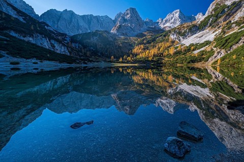 Mountains reflected in mountain lake, sun, autumn, Seebensee, Mieminger Kette, Tyrol, Austria,