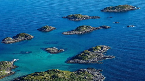 Coast and rocky islands in the blue sea, sea with archipelago islands, Ulvagsundet, Vesteralen,