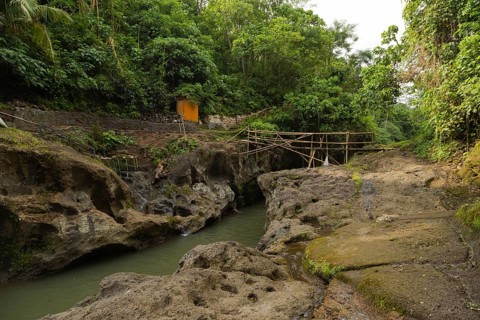 Uma Anyar waterfall, Bali island, Ubud, Indonesia. Jungle, tropical forest, daytime with cloudy sky