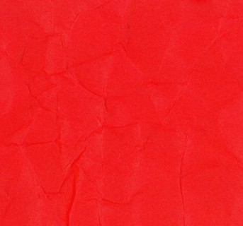 Crumpled red paper texture background