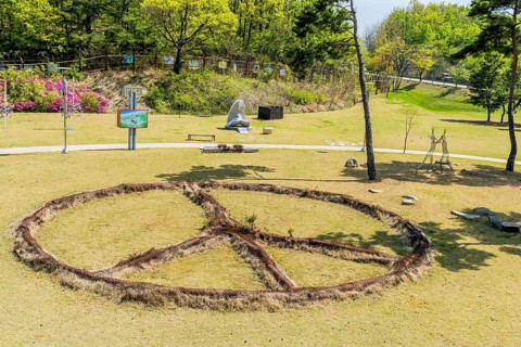Sculpture: Peace, by Victor Choi, made of rusted metal at DMZ Peace Park in Goseong, South Korea,