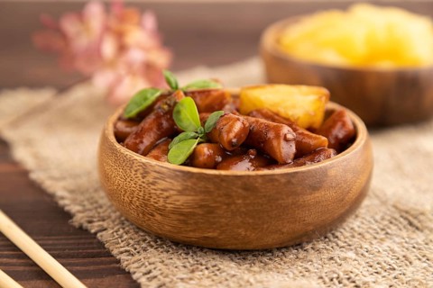 Tteokbokki or Topokki, fried rice cake stick, popular Korean street food with spicy jjajang sauce