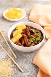 Tteokbokki or Topokki, fried rice cake stick, popular Korean street food with spicy jjajang sauce
