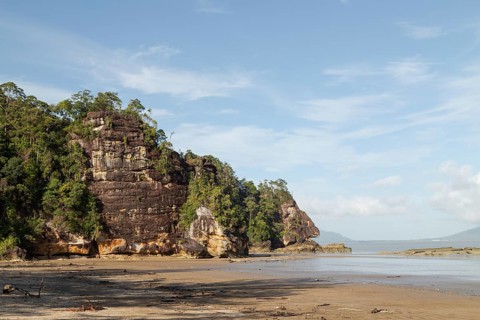 Cliff in Bako national park, sunny day, blue sky and sea. Vacation, travel, tropics concept, no