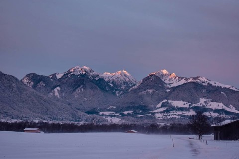 Snowy landscape at sunrise with mountain panorama, view of Wendelstein, Nussdorf, Bavaria, Germany,