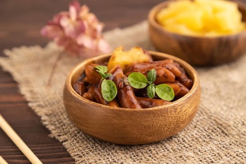 Tteokbokki or Topokki, fried rice cake stick, popular Korean street food with spicy jjajang sauce
