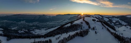 Sunset over the second Jura chain in winter, foreground contours of sinkholes, view towards the
