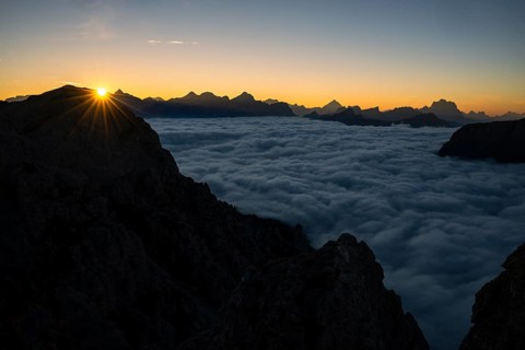 Sunrise over a sea of fog and Dolomite peaks in the background, Corvara, Dolomites, Italy, Europe