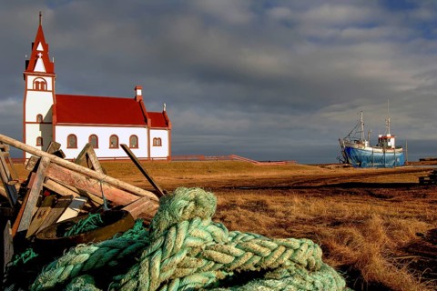 Church and ship at a shipyard, Raufarhoefn, North Iceland, Iceland, Europe