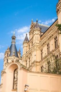 Castle lake facade of Schwerin Castle with towers and roofs, in the foreground the west bastion,
