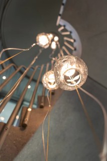 Modern Illuminated Hanging Lamp in Concrete Spiral Staircase with Railing in Switzerland