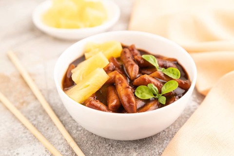 Tteokbokki or Topokki, fried rice cake stick, popular Korean street food with spicy jjajang sauce