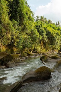 Uma Anyar waterfall, Bali island, Ubud, Indonesia. Jungle, tropical forest, daytime with cloudy sky