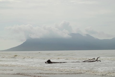 Bako national park, sea sandy beach, waves, overcast, cloudy day, sky and sea. Vacation, travel,