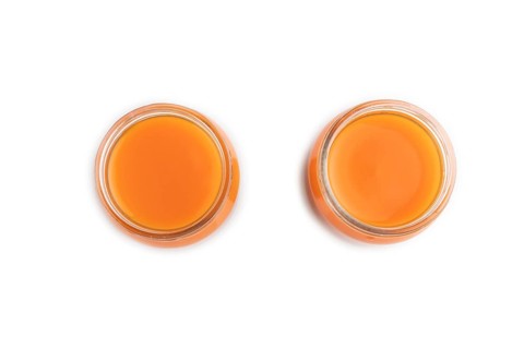 Baby puree with fruits mix, pumpkin, persimmon, mango infant formula in glass jar isolated on white