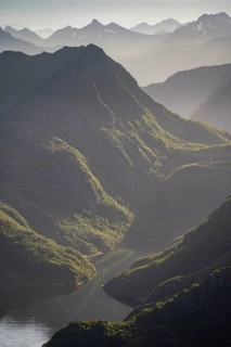 Fjord landscape with atmospheric evening light, Ulvagfjorden fjord and mountains, view from the top