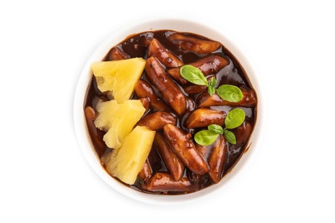 Tteokbokki or Topokki, fried rice cake stick, popular Korean street food with spicy jjajang sauce