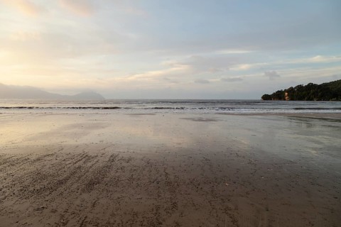 Bako national park, sea sandy beach, overcast, cloudy sunset, sky and sea, low tide. Vacation,