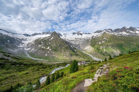 Picturesque mountain landscape, mountain hut Berliner Huette, mountain summit Steinmandl, summit