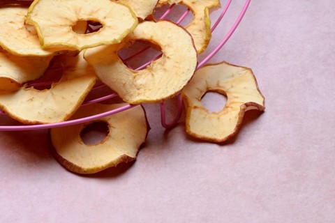 Dried apple rings on a grid, dried fruit
