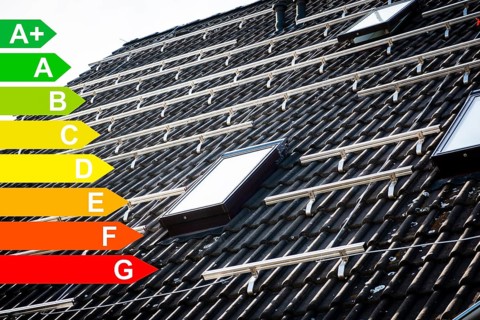 Mounted brackets for solar panels on the roof of a house, graphic with energy efficiency classes