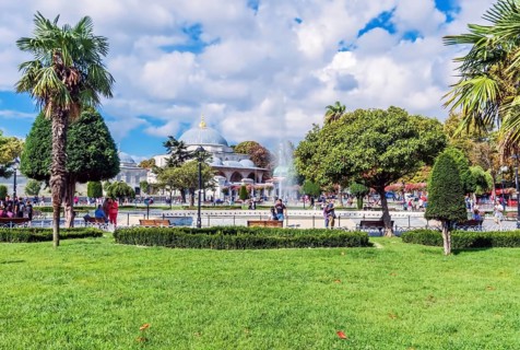 Landscape of fountain in Sultanahmet plaza with Hagia Sophia mosque in background in Istanbul,