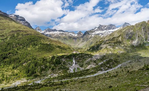 Picturesque mountain landscape, rocky mountain peaks with snow, valley Zemmgrund with Zemmbach and