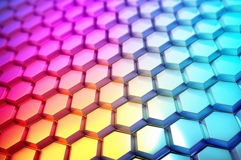 Gradient honeycomb pattern illuminated with vibrant colors. Ideal for backgrounds, wallpapers, and