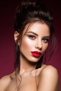 Gorgeous Young Brunette Woman face portrait. Beauty Model Girl with bright eyebrows, perfect