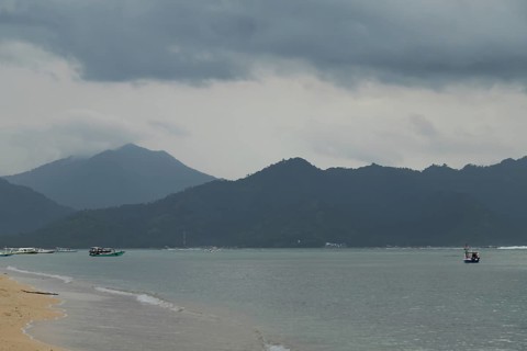 Lombok and Gili Air islands, overcast, cloudy day, sky and sea. Vacation, travel, tropics concept,