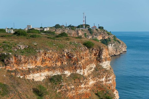 Lighthouse on the cliff edge with a view of the sea, Cape Kaliakra, Dobruja, Black Sea, Bulgaria,
