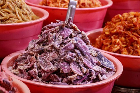 Fermented salted squids and shrimps displayed and sold at the local Samaki Market showing the
