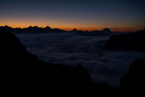 Sunrise over a sea of fog and Dolomite peaks in the background, Corvara, Dolomites, Italy, Europe