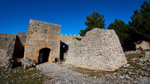 Sunny view of the entrance gate of an old fortress ruin, Chlemoutsi, High Medieval Crusader Castle,