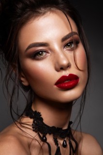 Gorgeous Young Brunette Woman face portrait. Beauty Model Girl with bright eyebrows, perfect