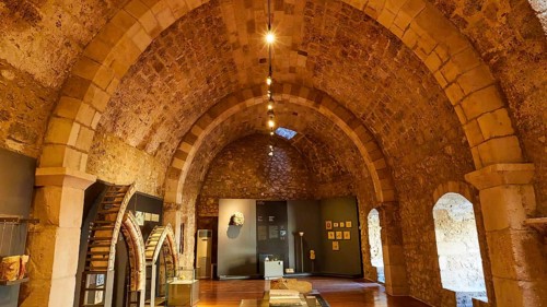 An exhibition room with vaulted ceiling in a historic stone construction, Museum, Chlemoutsi, High