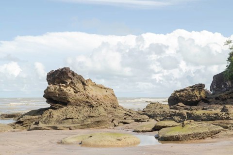 Cliff in Bako national park, sunny day, blue sky and sea. Vacation, travel, tropics concept, no