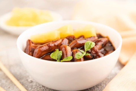 Tteokbokki or Topokki, fried rice cake stick, popular Korean street food with spicy jjajang sauce