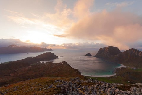 View of Haukland Beach from the summit of Holandsmelen, Lofoten. Dramatic sunset in autumn
