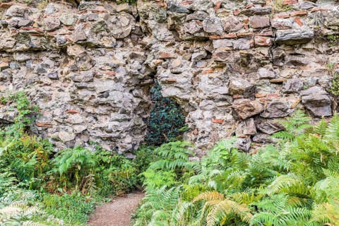 Interior stone and brick wall of castle ruins with with opening for egress in Istanbul, Tuerkiye