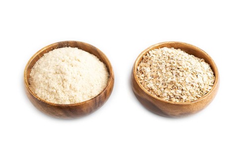 Powdered milk and oatmeal baby food mix, infant formula isolated on white background. Side view,