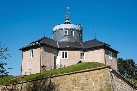 Wilhelmstein Fortress, historic castle with tower, tower clock and weather vane under a clear blue,