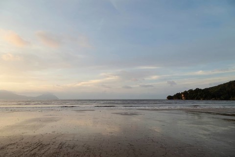 Bako national park, sea sandy beach, overcast, cloudy sunset, sky and sea, low tide. Vacation,