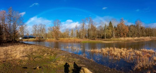 Rainbow over the source of the Danube, the confluence of the Breg and Brigach rivers to form the