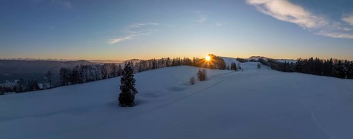 Sunset over the second Jura chain in winter, foreground contours of sinkholes, view towards the