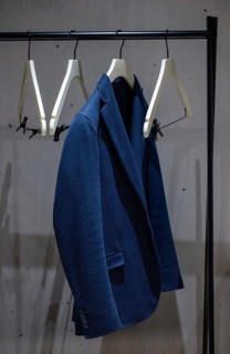 Suit Jacket Hanging in Office Cubby on a Clothes Hanger in Switzerland