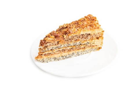 Walnut and hazelnut cake with caramel cream isolated on white background. side view