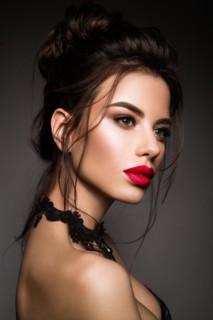 Gorgeous Young Brunette Woman face portrait. Beauty Model Girl with bright eyebrows, perfect